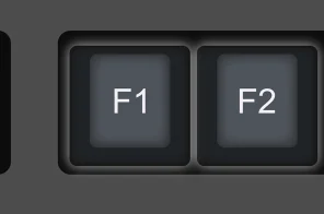 Um teclado de computador com foco nas teclas F1 e F2