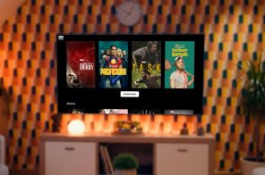 TV fixada na parede exibindo o catálogo da HBO Max, disponível com a Desktop Internet.